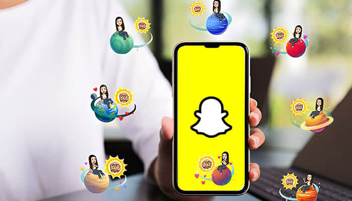 Person holding a smartphone displaying the Snapchat logo, surrounded by colorful Snapchat Planets in Order icons representing different friendship levels