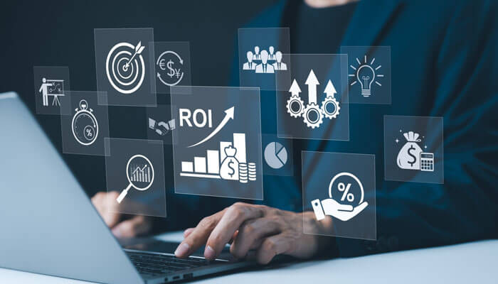 ROI and Measurable Adoption - Startupeditor | Startup Editor Business professional analyzing ROI and performance metrics on a laptop to plan smarter operations for business growth.
