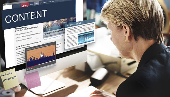 Write SEO-Optimised Articles - Startupeditor | Startup Editor A student entrepreneur working on a computer, researching content related to business, stock markets, and industry trends, with multiple tabs open for analysis.