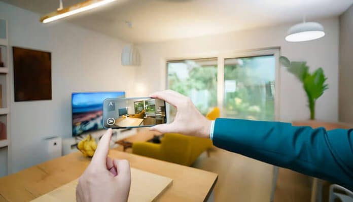 Person capturing a room photo on a smartphone, illustrating visual storytelling in business and branding