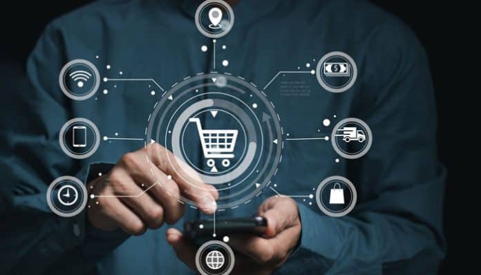 Businessman using smartphone with digital shopping icons, representing secure transactions on an international ecommerce platform.