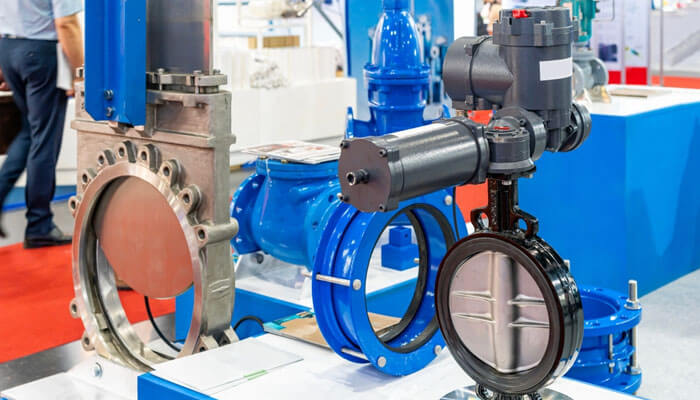 Choosing hardware that grows with your process - Startupeditor | Startup Editor Industrial electric actuators displayed with valves and control systems for heavy-duty automation in industrial applications.