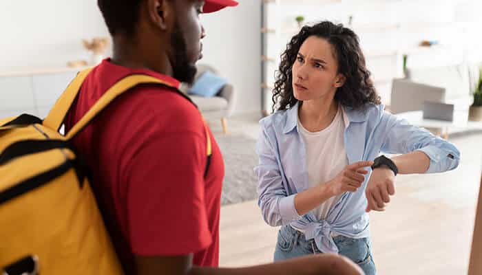 Customer frustrated with late package delivery, highlighting the need for address lookup for delivery accuracy to avoid costly delays