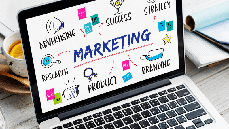 A laptop screen displaying marketing concepts such as advertising, strategy, branding, and research, symbolizing BrandLume’s comprehensive digital marketing solutions.