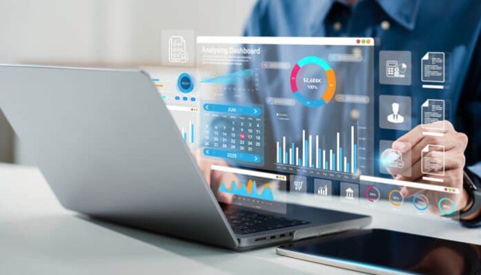 Person using laptop with data analytics dashboard, illustrating digital tools for small businesses to manage finances, inventory, and growth.