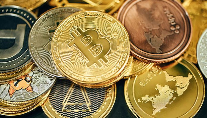 Collection of digital coins including Bitcoin, Ethereum, and altcoins, representing the top 100 cryptocurrencies for investment analysis.