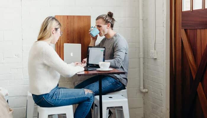 Employees improving forecast accuracy and revenue predictions through opportunity management tool