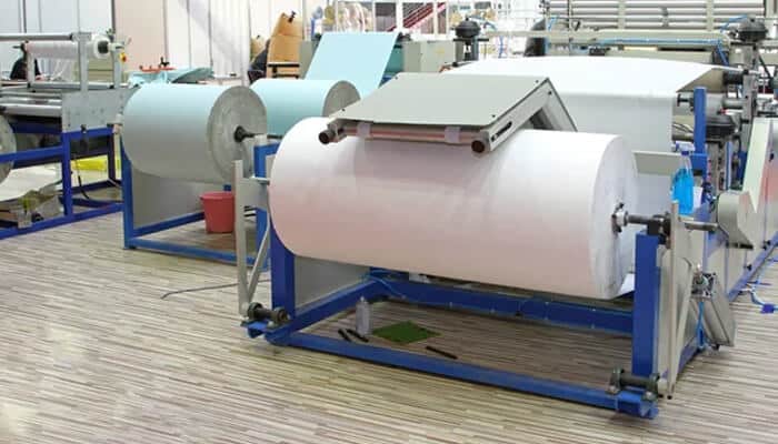 Manufacturing process of organic cotton hand towels in a textile factory, showcasing the use of eco-friendly materials for towel production.