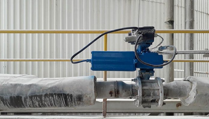 Industrial electric actuator mounted on a pipeline, showcasing precision motion control in heavy-duty automation applications.