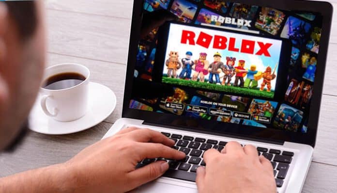 A person playing Roblox on a laptop while searching for inspiration and ideas for creating good Roblox usernames that stand out in the gaming community.