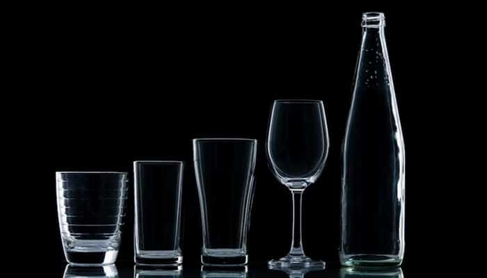 Elegant range of Branded Glassware including tumblers, wine glasses, and bottles designed for corporate events and brand promotion.