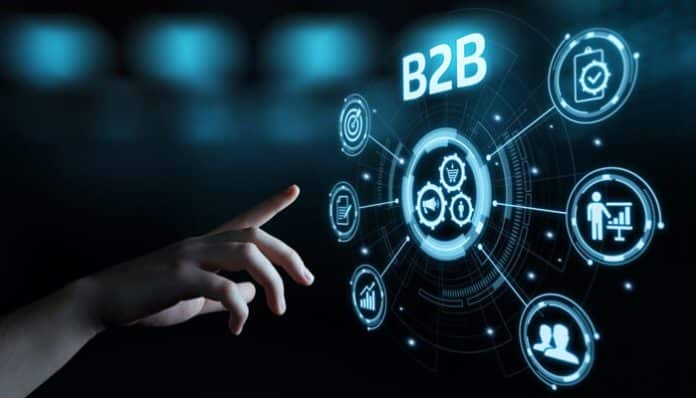 Hand pointing at digital interface with B2B icons, representing modern B2B marketing technology for data-driven strategies and personalized campaigns.