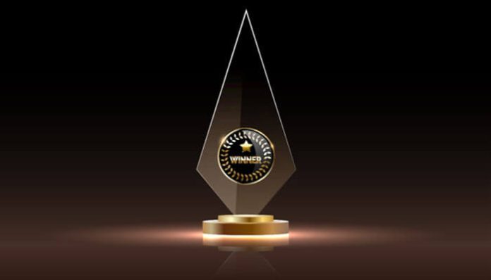 A custom crystal trophy with a gold base, representing award ideas for clients, a unique way to show appreciation and strengthen client relationships.