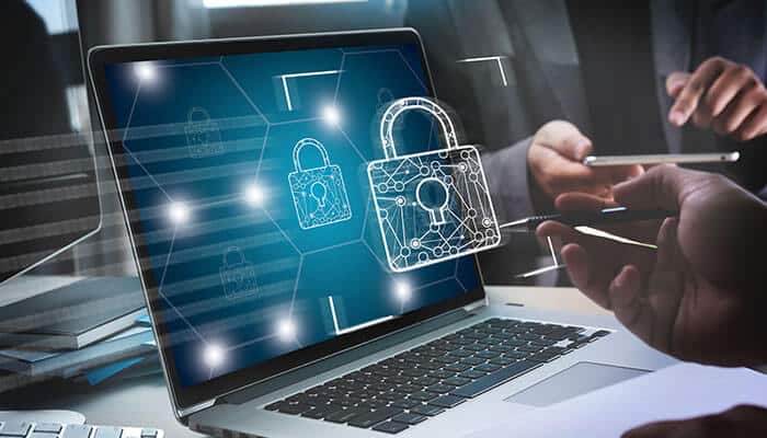 A laptop displaying digital padlocks symbolizing secure data protection, highlighting the importance of data security when using a W-2 generator for employee tax forms.