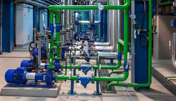 Advanced industrial pumps and piping systems inside a facility, showcasing fluid handling innovation in modern operations.
