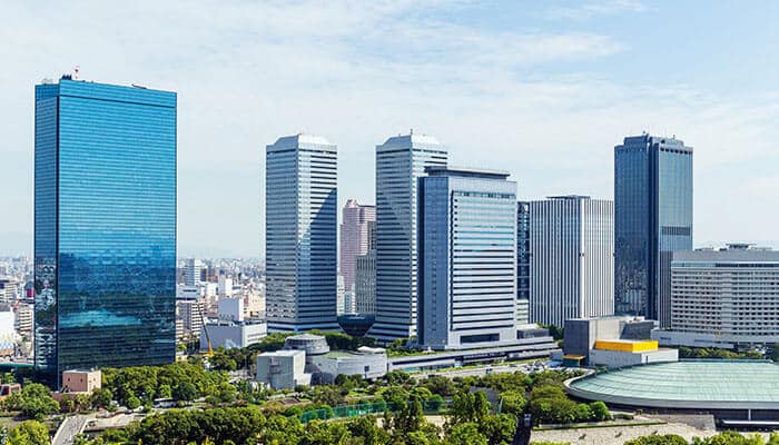 A cityscape view of modern high-rise buildings showcasing functional architecture that combines aesthetic design with structural efficiency and practical purpose.