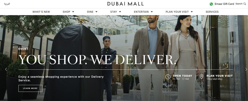 Shoppers walking inside Dubai Mall, promoting luxury shopping and delivery services in a modern retail environment.