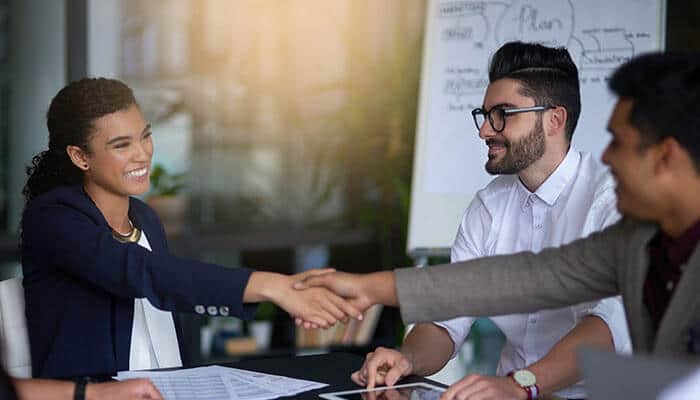 The Relational Advantage - Startupeditor | Startup Editor Entrepreneurs shaking hands during a business meeting, symbolizing trust, collaboration, and partnership in relationship-driven startups focused on growth and teamwork.