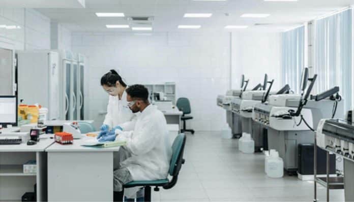 Modern laboratory with researchers using advanced equipment, showcasing emerging lab technologies in action.