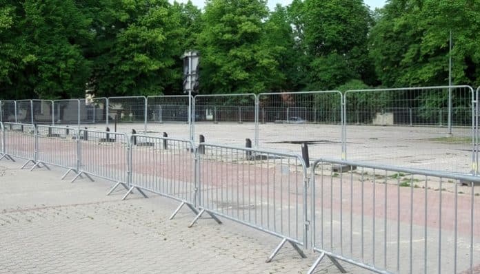 Temporary fencing set up around an open outdoor area, demonstrating the use of Temporary Fencing for safety and crowd control at events or project sites.