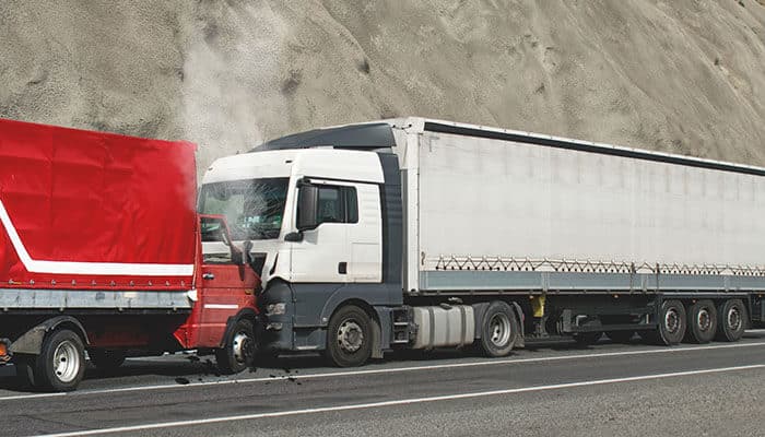 Truck accident on the road highlighting the importance of trucking industry accident prevention through proper maintenance, safe driving, and adherence to safety standards