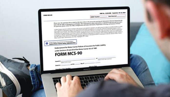 Person researching MCS-90 insurance endorsement on a laptop, reviewing legal compliance for commercial trucking accident claims