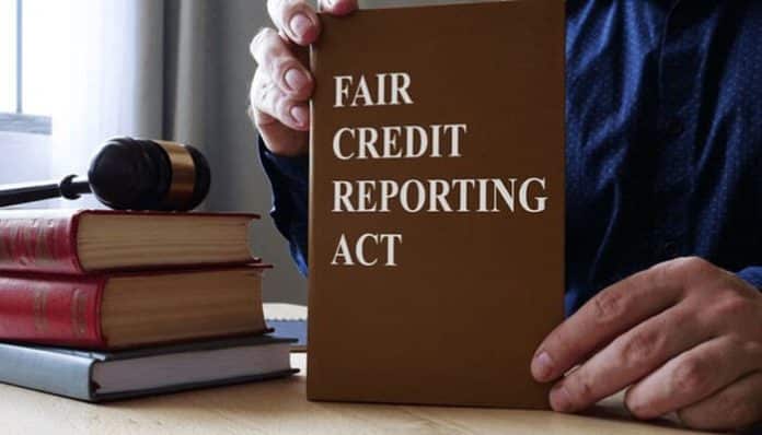 Fair Credit Reporting Act law book displayed on a desk with legal materials, representing consumer rights and credit reporting protections