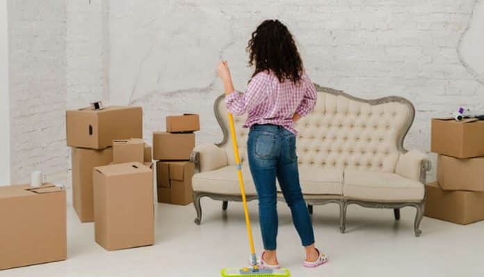 Tenant moving out of a rental property while cleaning and preparing the home before inspection
