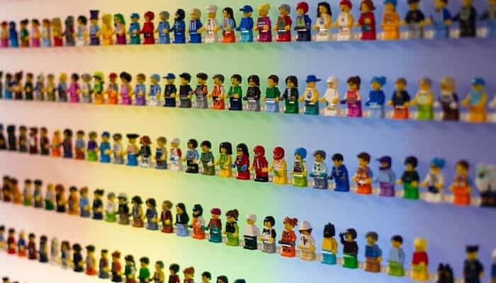 A diverse collection of Lego minifigures neatly arranged on display, perfect for a business selling collectibles. This type of inventory highlights the market potential for specialized collectible businesses