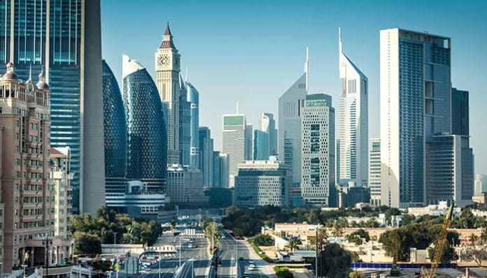 Dubai skyline showcasing iconic buildings, symbolizing the dynamic real estate market and opportunities when buying your first Dubai apartment.