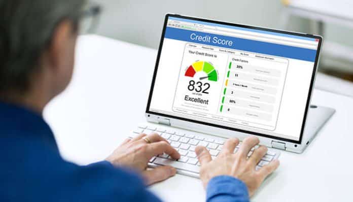 Credit scoring software displayed on a laptop screen, showcasing the importance of choosing the right credit scoring software for lending businesses