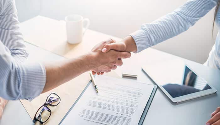 Startup Agreements confirmed as founders and investors finalize terms with a professional handshake