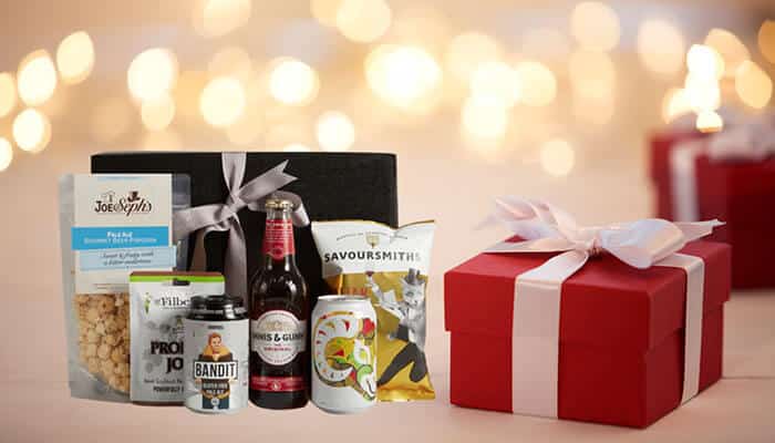 A stylish London hamper with gourmet snacks, drinks, and treats, perfect for corporate gifts or celebrations, showcasing quality and elegance.