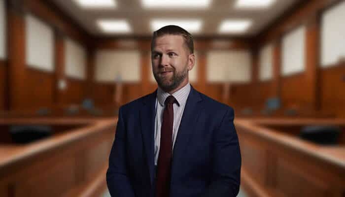 Attorney from Liberty Law Group standing confidently in a courtroom setting