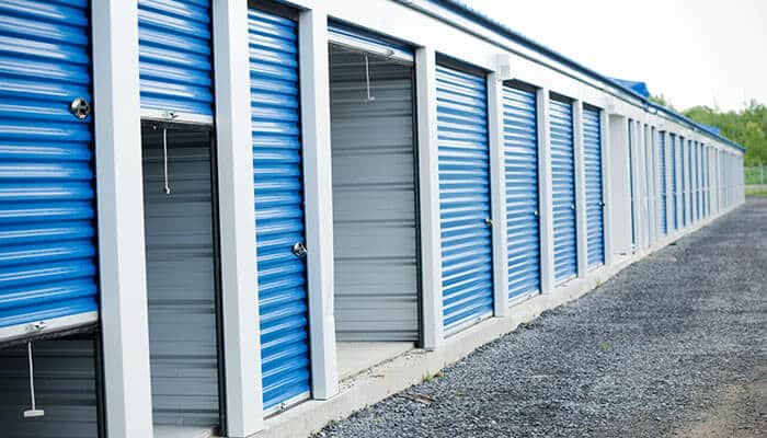 A row of secure blue self-storage units, representing the variety of options available when choosing the perfect self-storage unit for your needs
