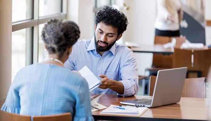 Business Bank Selection guidance as an advisor helps a business owner review banking options