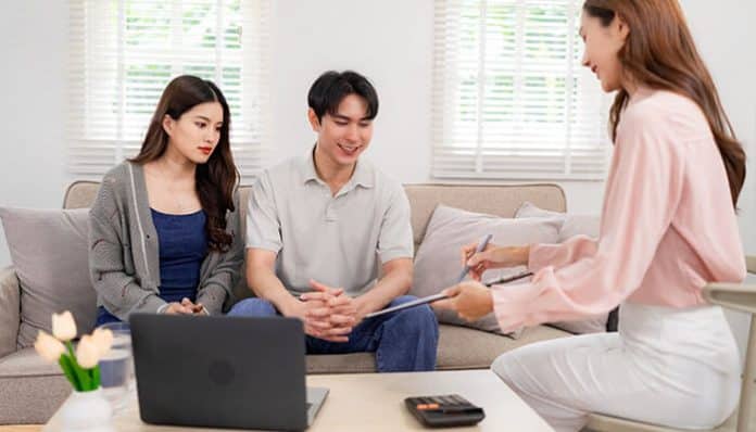 Financial Advisors providing personalized wealth planning guidance to a couple during a consultation