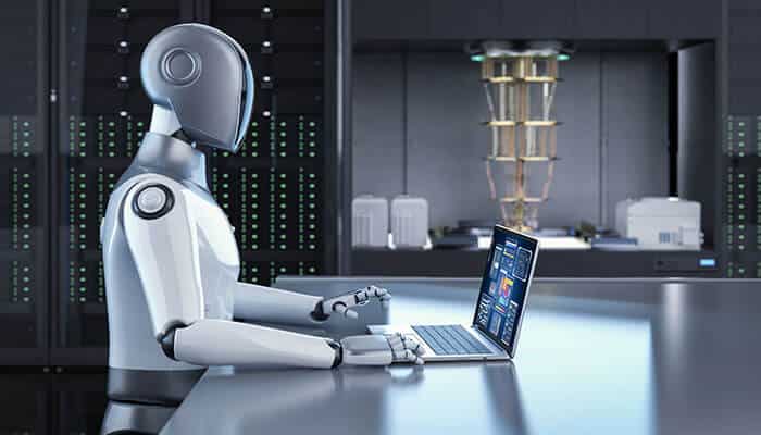 A humanoid robot analyzing data on a laptop to help generate Ideal Customer Profiles in B2B marketing using AI technology.