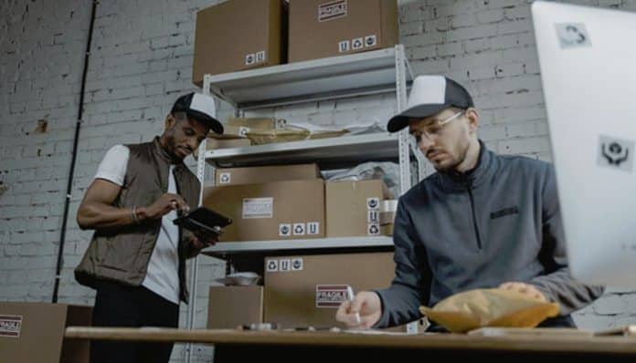 Micro Warehousing in action as a startup team packs and manages inventory in a compact storage space