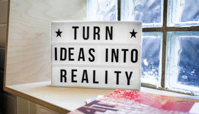 A sign reading Turn Ideas into Reality emphasizing the power of innovation and transformation, aligning with the benefits of field service CRM in enhancing business operations