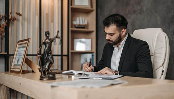 Best Lawyer on the Gold Coast reviewing legal documents and preparing a client case