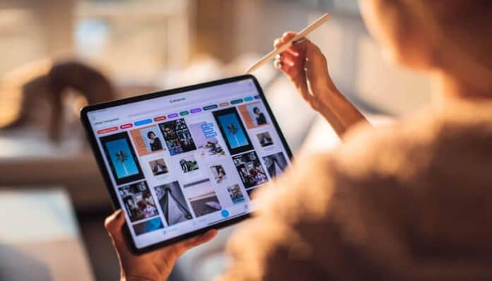 Person browsing products on a tablet, illustrating how to improve user experience in online store for smoother shopping.