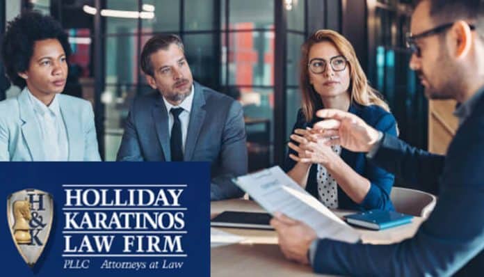 Attorneys at Holliday Karatinos Law Firm discussing a case with clients in a professional meeting