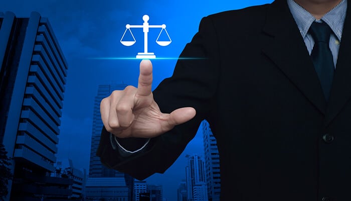 Business law scale of justice symbol, representing the legal aspects of business for sale transactions and ensuring fair practices.