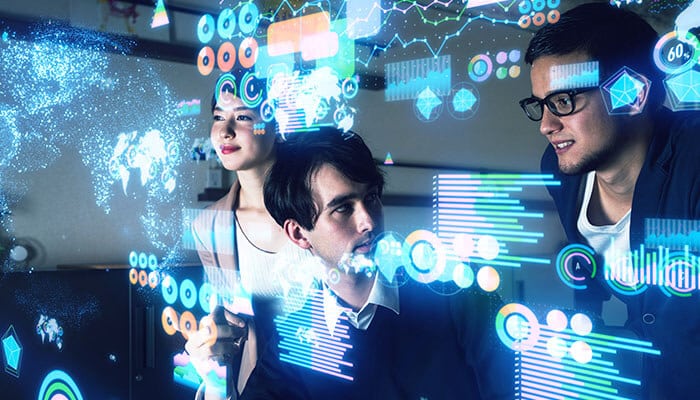 Team analyzing digital data and charts illustrating digital transformation consulting