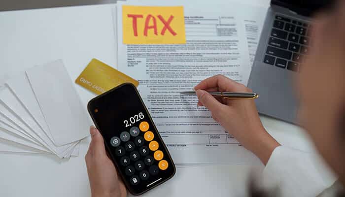 Financial Advisors assisting with tax planning and financial calculations to optimize investments