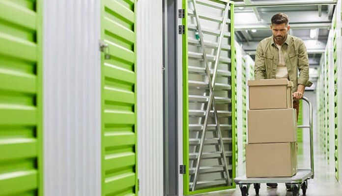 Moving boxes into the perfect self-storage unit, showcasing the convenience and organization of using a storage facility for personal storage