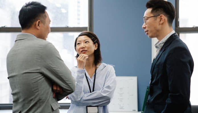 Business leaders engaged in a discussion, exemplifying collaboration and leadership in a dynamic work environment, essential for navigating today's fast-changing economy