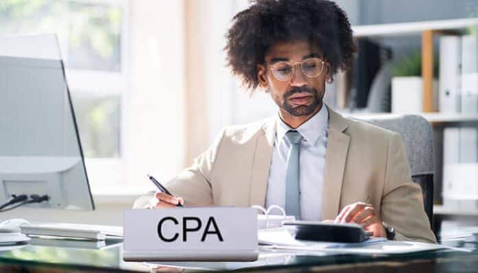 A professional CPA working at their desk, representing the trusted financial guidance provided by Marion CPAs to local businesses in Marion
