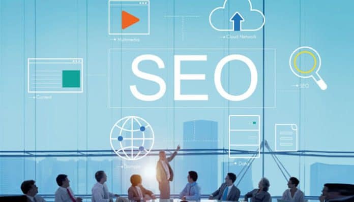 SEO concept with a group of professionals discussing digital marketing, with icons representing SEO elements like search, content, and cloud storage